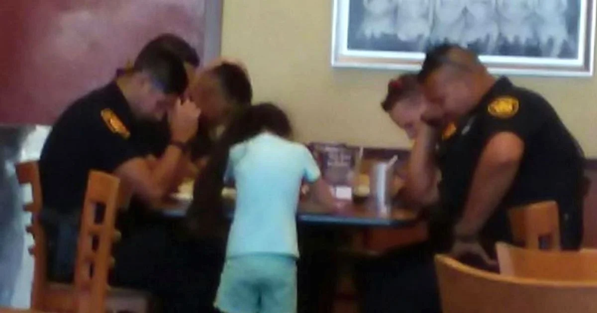 Little Girl Prays With Police Officers Mourning The Loss Of A Colleague